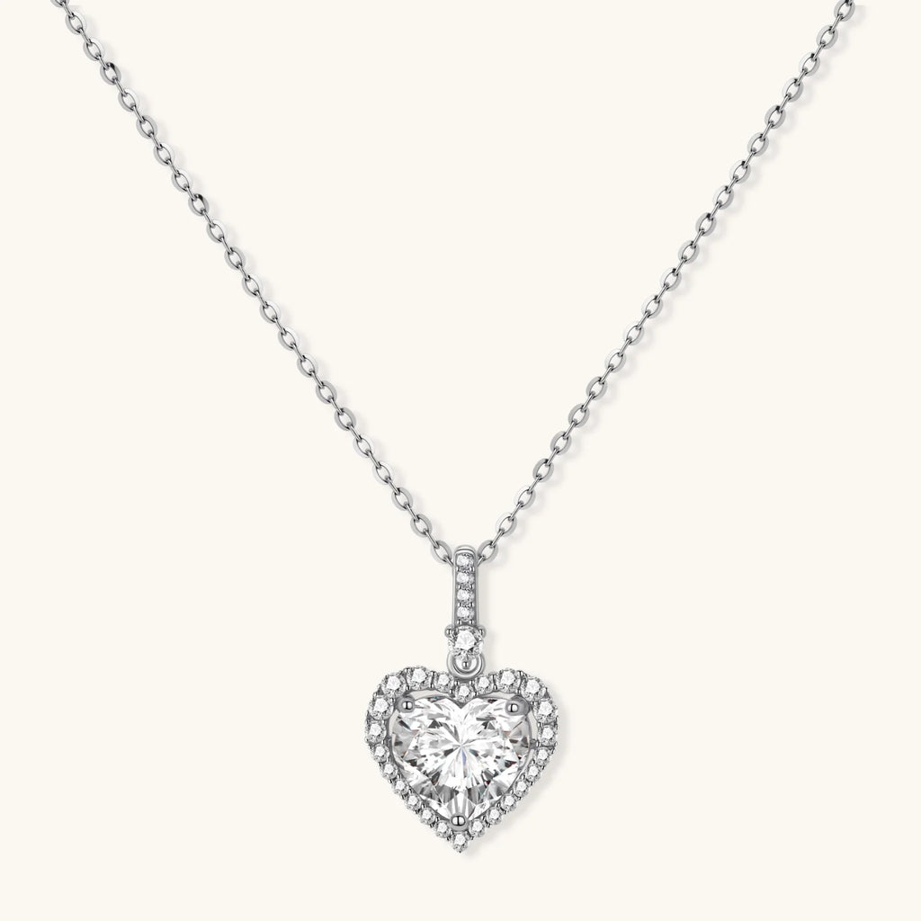 Sterling silver heart pendant necklace with brilliant moissanite center stone and halo setting on delicate chain