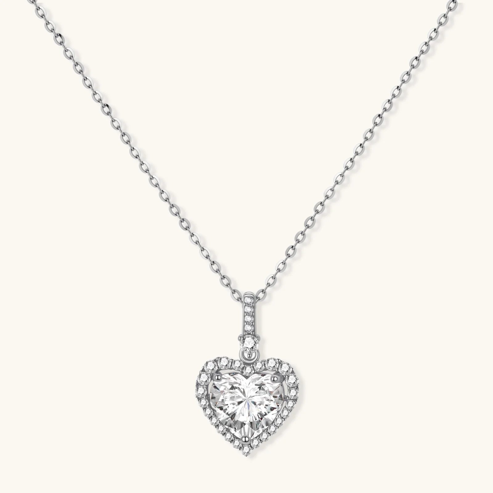 Sterling silver heart pendant necklace with brilliant moissanite center stone and halo setting on delicate chain